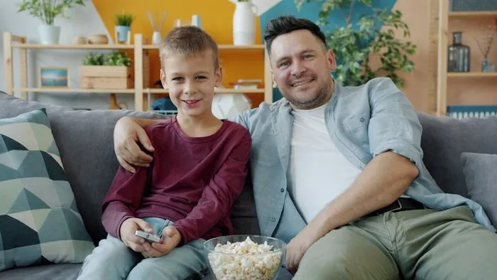 Family enjoying a movie night together